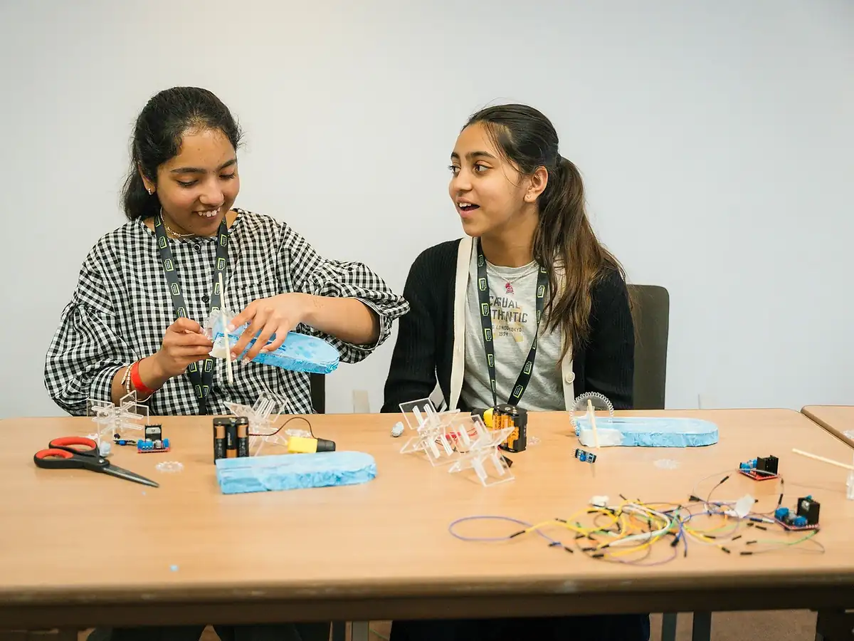 Students assembling electronics
