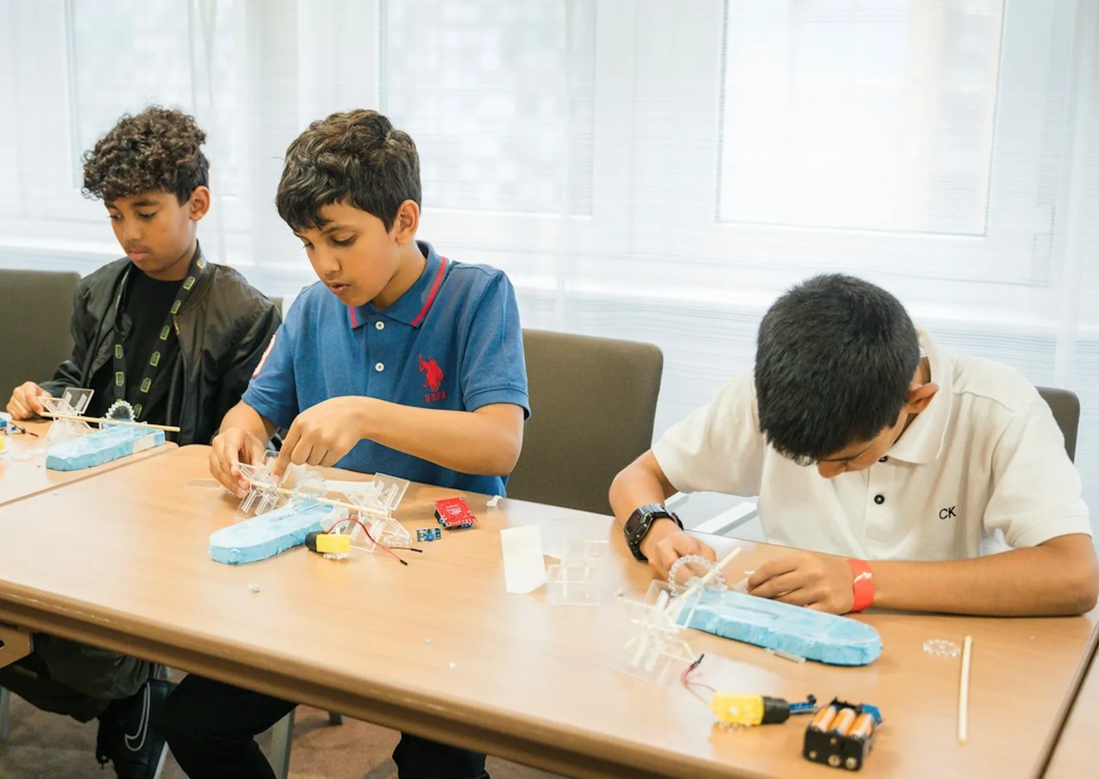 Luminary Tech Path students building electronics projects at The Exchange