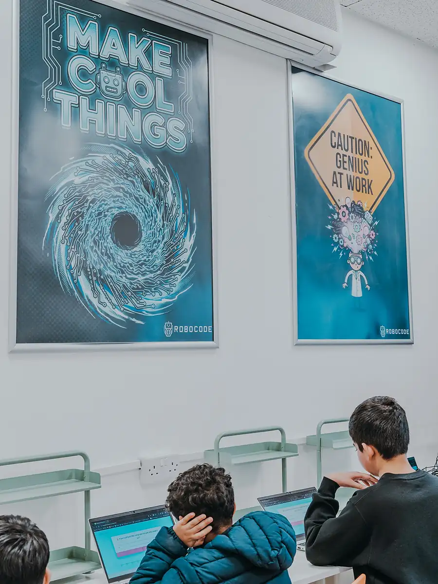 Students coding on laptops